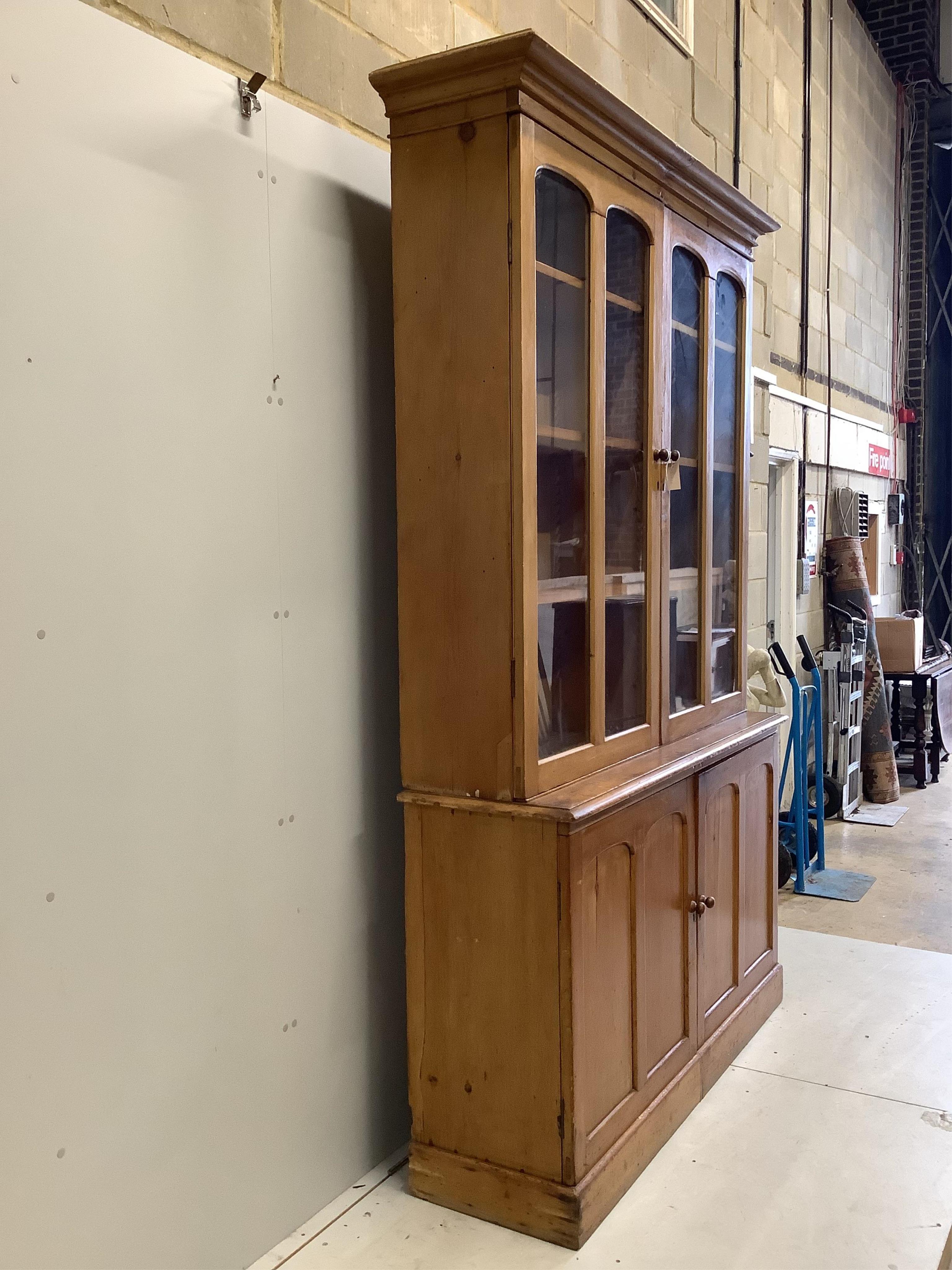 A Victorian pine library bookcase, width 154cm, depth 46cm, height 242cm. Condition - fair